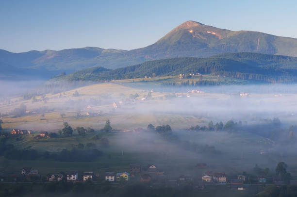istock Morning landscape with mountain village 1001687996