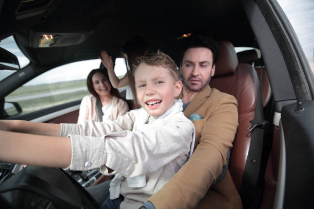 istock happy son driving a car 1001688398