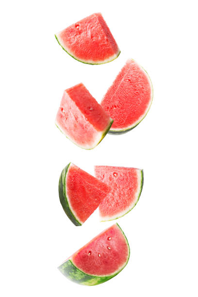 istock Sliced falling watermelon isolated on white background with clipping path as package design element and advertising. Floating fruits in the air 1001703286