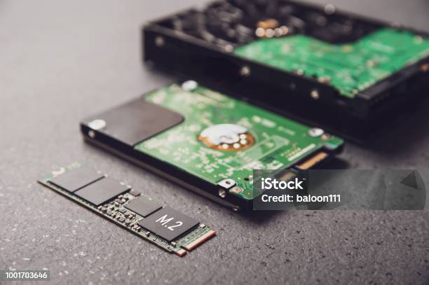 Drives Arranged On A Stone Table Symbolizing The Development Of Technology From Hdd To Ssd Stock Photo - Download Image Now