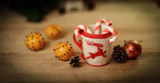 istock Christmas Cup and oranges on wooden background blurred 1001712810