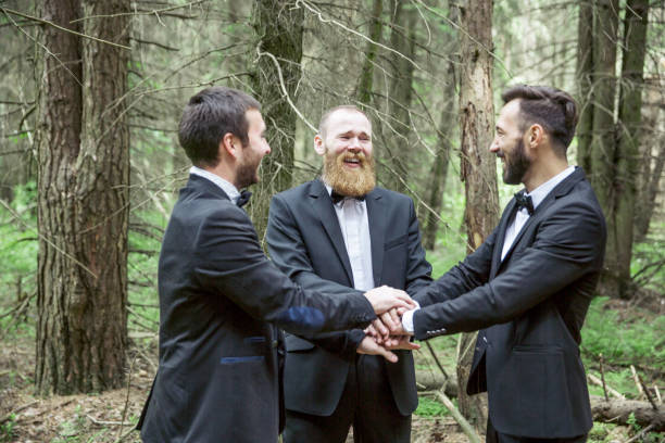 istock business partners standing with folded hands together 1001731508