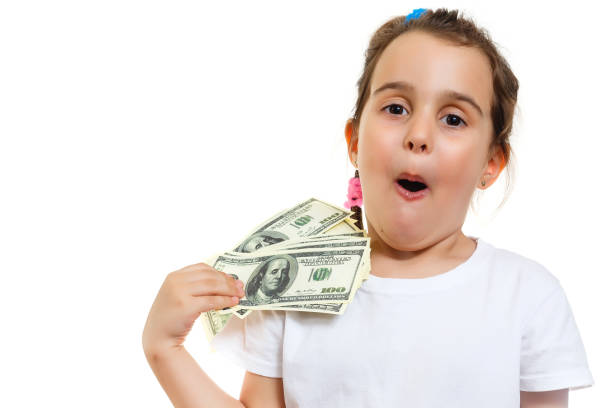 istock Cute girl holding money 1001734244
