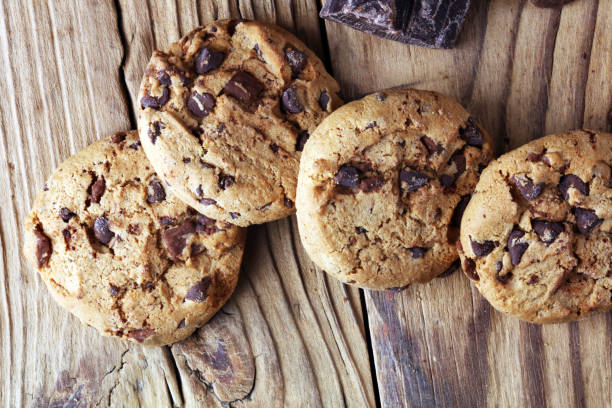 istock Chocolate cookies on table. Chocolate chip cookies shot with chocolate 1001737944