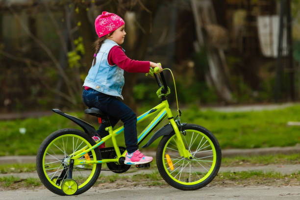 Little girl with her bicycle