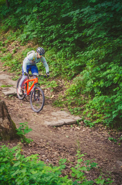 istock A cyclist in a helmet is riding off-road 1001739528
