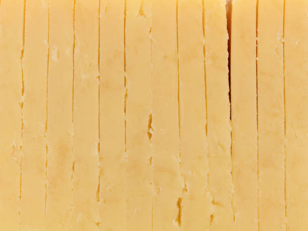 istock Close view of gouda cheese slices 1001742516
