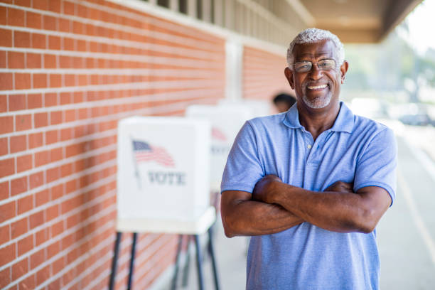 istock Senior Black Man Voting Portrait 1001754722