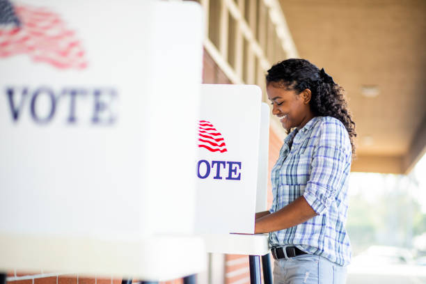 istock Beautiful Young Black Girl Voting 1001754772