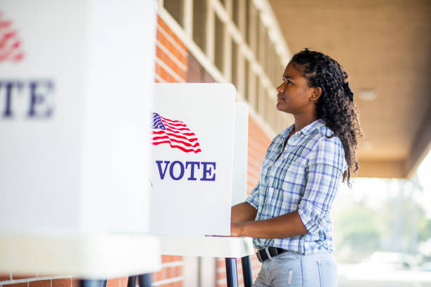 istock Beautiful Young Black Girl Voting 1001754844