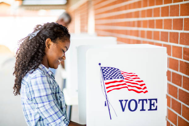 istock Beautiful Young Black Girl Voting 1001754880