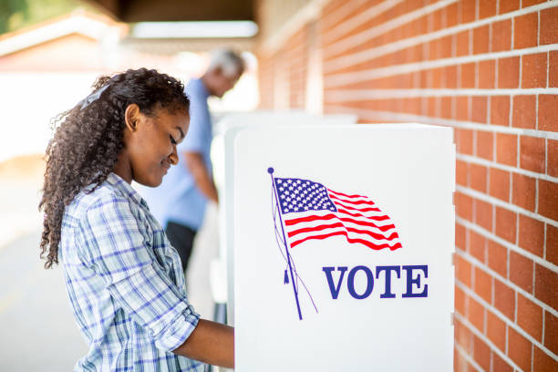 istock Beautiful Young Black Girl Voting 1001754882