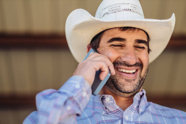 istock Utah  cowboy with mobile phone 1001757084