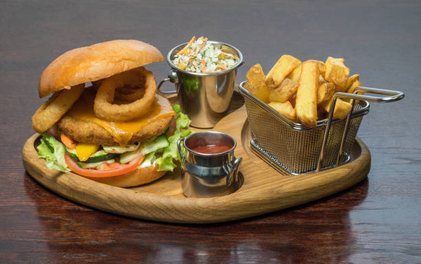 istock Beer and snacks. Burger and fries. Hamburger and chips. 1001773064