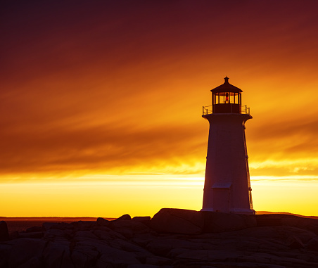 An amazingly colourful sunset at Peggy's Cove Lighthouse.