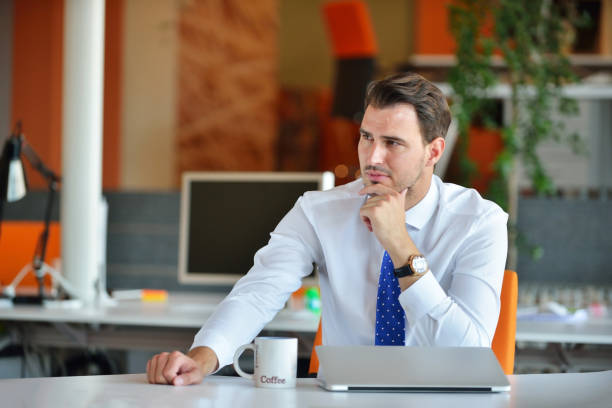 istock Handsome businessman working with laptop in office 1001794282