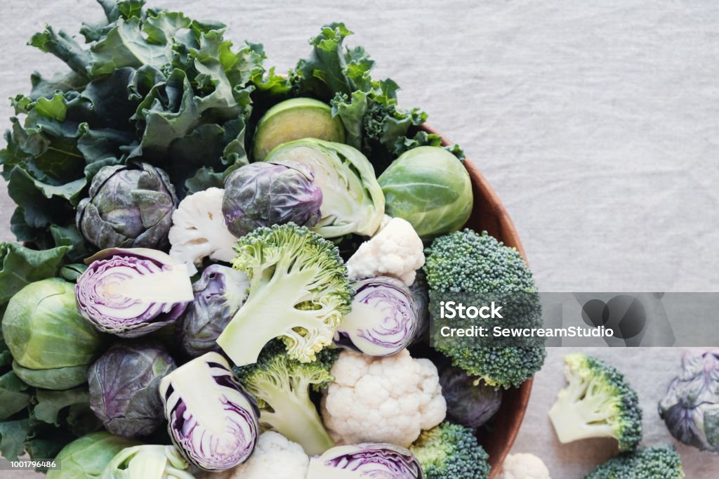 cruciferous vegetables, cauliflower,broccoli, Brussels sprouts, kale in wooden bowl, reducing estrogen dominance, ketogenic diet Vegetable Stock Photo