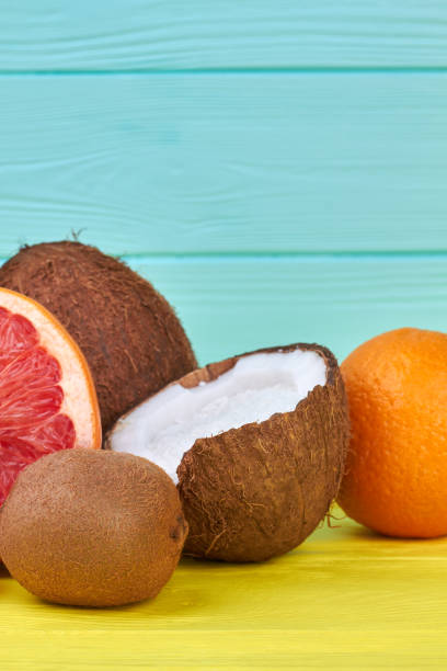 istock Exotic fruits on blue and yellow background. 1001802420