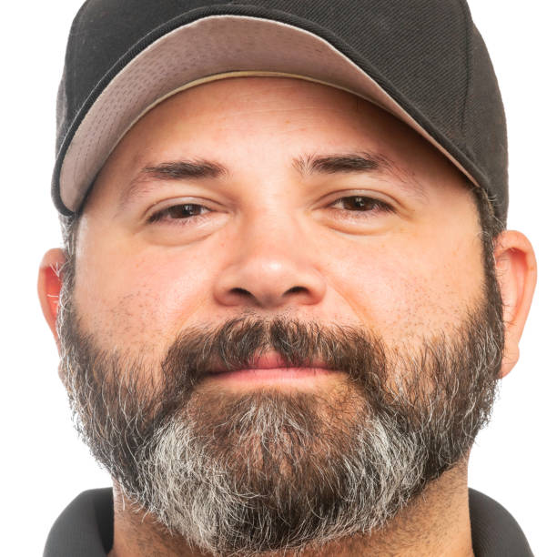 Mid adult man looking at the camera on white background