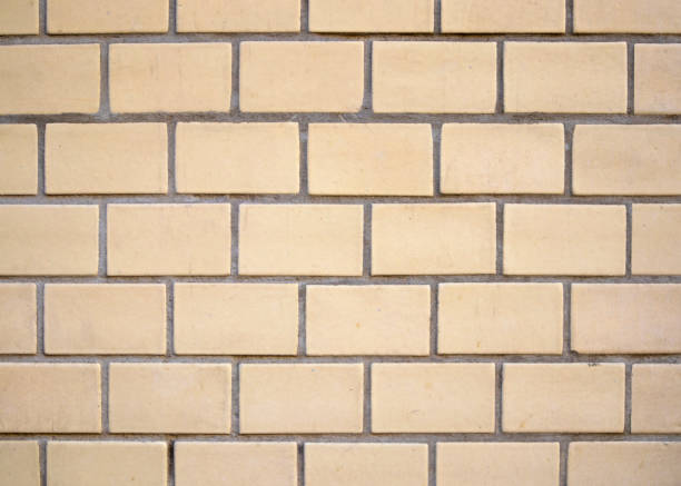 istock Masonry fragment of white bricks, grunge brick wall pattern 1001802636