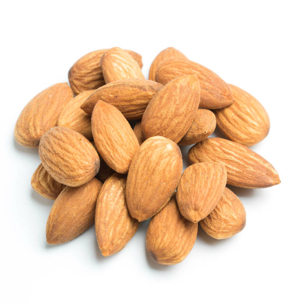 istock closeup of almonds isolated on the white background 1001803060