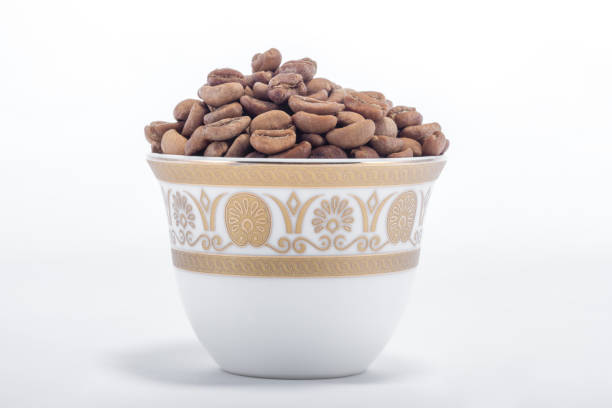 closeup for raw coffee beans in arabian coffee cups