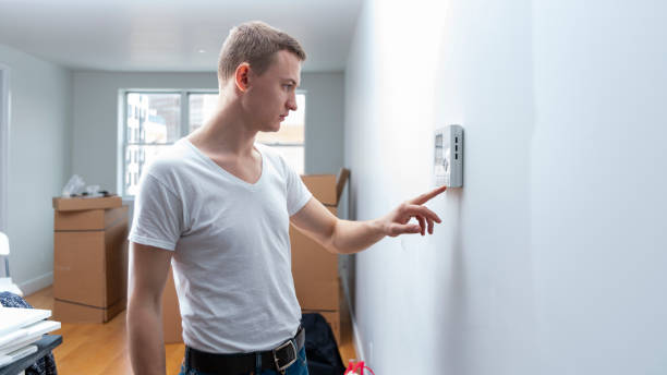 istock The young man learning how to use the intercom in the new recently purchased apartment 1001814054