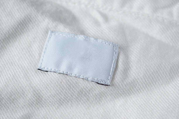 istock White blank laundry care clothes label on cotton shirt 1001814408