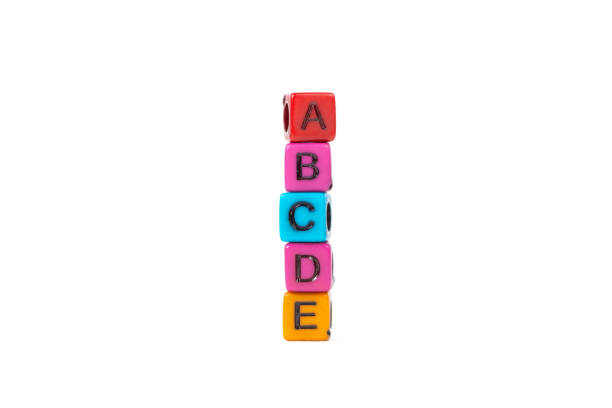 istock Pile of letter bead or beads with alphabet ABCDE on white background. 1001814710