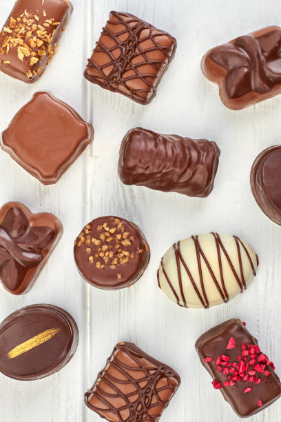 istock Assortment of chocolate candies on white background. 1001820180