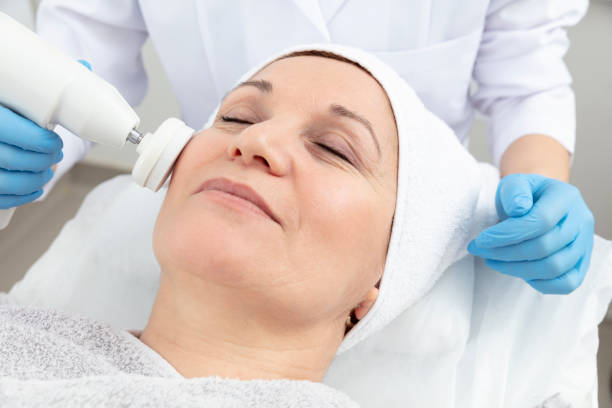 istock The cosmetologist is caring for the patient's face 1001822882