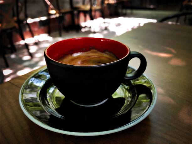 istock Black and red espresso cup on the table 1001830712