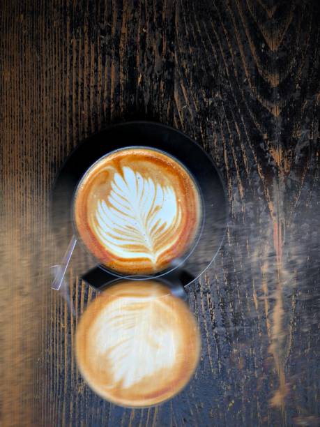 Double exposure of coffee latte on a wood table