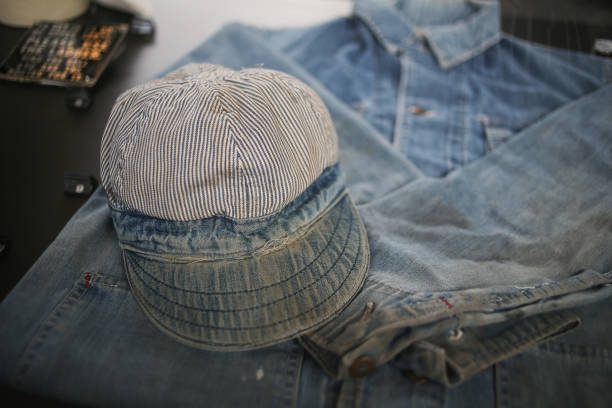 istock Vintage Railway Worker Conductor Uniform - Denim with White and Blue Stripped Hat 1001835816