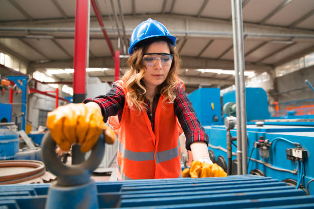 istock Young female working in factory 1001861694