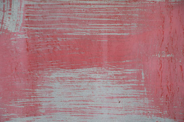 istock Grungy red metal painted sheet peeling paint wallpaper background 1001866044