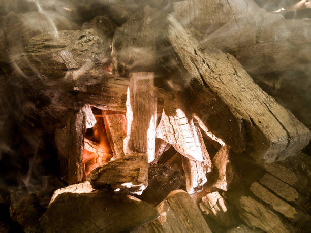 istock Coal on a barbecue grill with fire, coals and a little smoke 1001874446