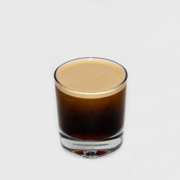 Nitrogen infused cold brew coffee on a white background.
