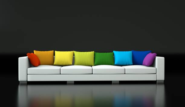 istock Interior design modern bright room with white sofa and rainbow pillows 1001897628