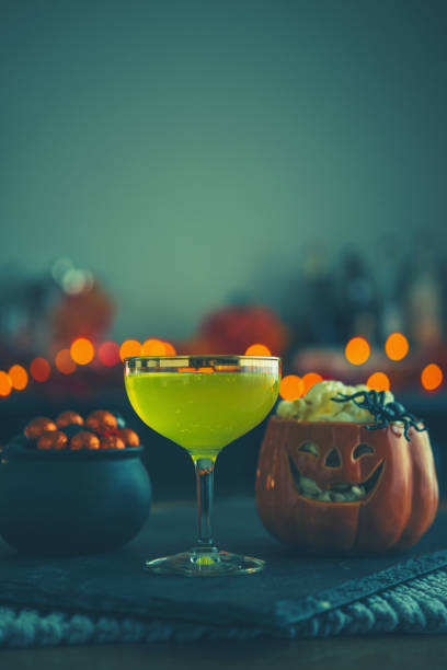 istock Halloween time. Vibrant colored drinks with cauldron of popcorn 1001912180