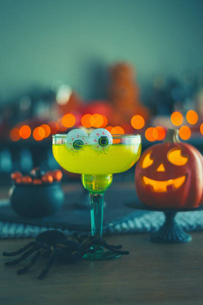 istock Halloween time. Vibrant colored drinks with cauldron of popcorn 1001912200