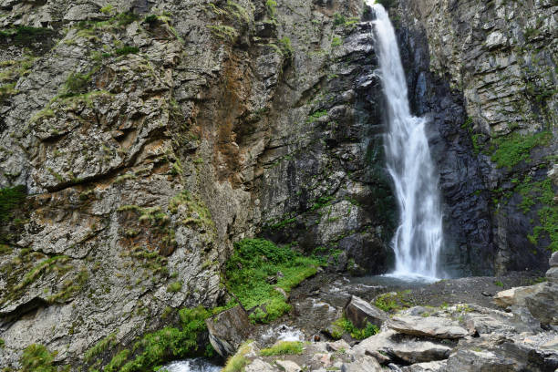 Gveleti Big Waterfalls being in a Dariali Gorge near the Kazbegi city in the mountains of the Caucasus, Geprgia
