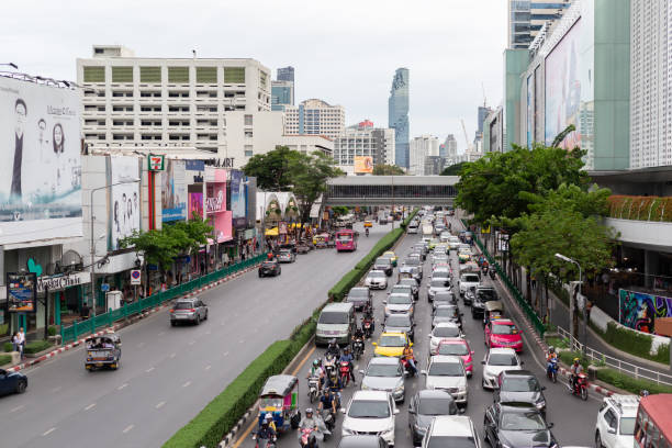 traffic in front of mbk or "mahboonkrong center". - mbk imagens e fotografias de stock