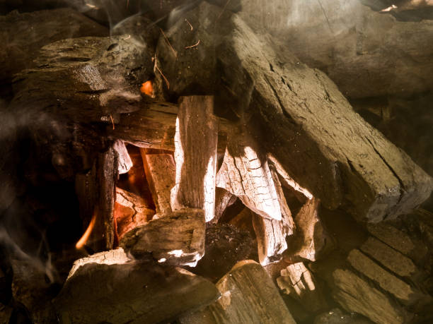 istock Coal on a barbecue grill with fire, coals and a little smoke 1001948384