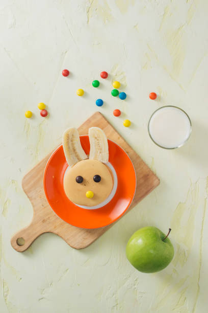 istock Funny bunny pancakes with fruits for Easter kids breakfast 1001955906
