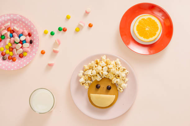 istock concept kid breakfast with pancake top view on white background 1001956162