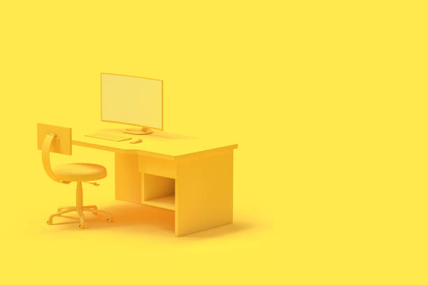 istock Minimal concept, computer on table and chair yellow color 1001956176