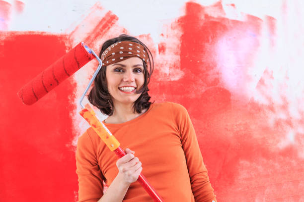 istock Carefree woman redecorating at home 1001966888