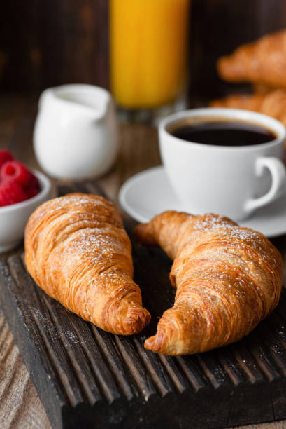 istock Croissants, coffee, orange juice and berries. Continental breakfast 1001971958