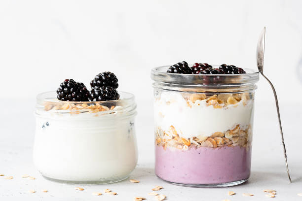istock Breakfast parfait, overnight oats and greek yogurt in a jar 1001971982